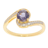 Round purple sapphire ring in gold setting with accent stones, showcasing elegance and luxury for sophisticated style.